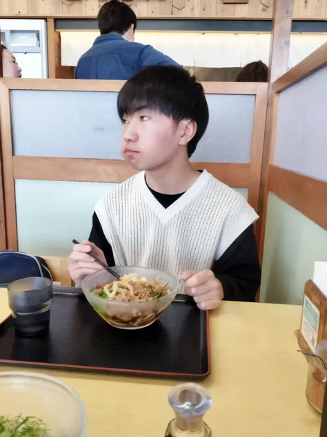 A boy sitting at a table with a bowl of food, eat ramen, eat noodles, Mukbang, Shot on a Canon 80d, Shot on Sony Alpha 9, eat, he about 2 5 years old, Very low quality images, Low quality photos, Blog Photos, he! About 30 years old