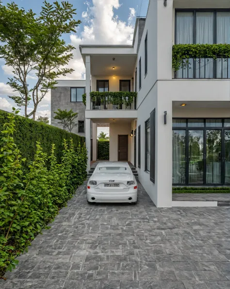 raw photo, Masterpiece, high quality, best quality, authentic, super detail, outdoors, onestoreyvillaXL, aiaigroup, house style modern on the street ,stairs, white wall ,road,pavement, grass, trees, sky, cloud, (daylight:1.1)
