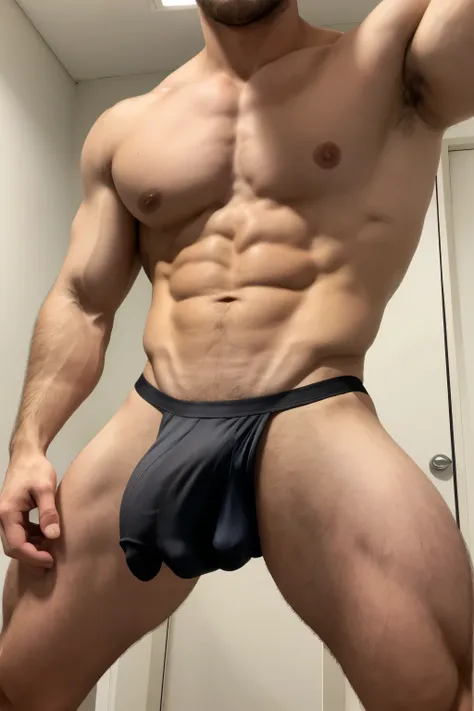 Handsome muscular young boy wearing black micro thong , huge bulge 