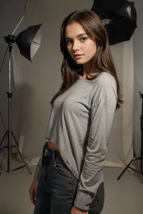 young woman aged 20, posing in a photostudio, grey background