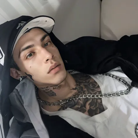 Man with a tattoo on his chest lying on a sofa, tommy 1 6 anos, 18 anos de idade, 1 6 anos, ele tem cerca de 2 0 anos, ele tem cerca de 20 anos, androgynous male, com tatuagens, cool appearance, xxxtentacion, selfie, androgynous person, androgynous