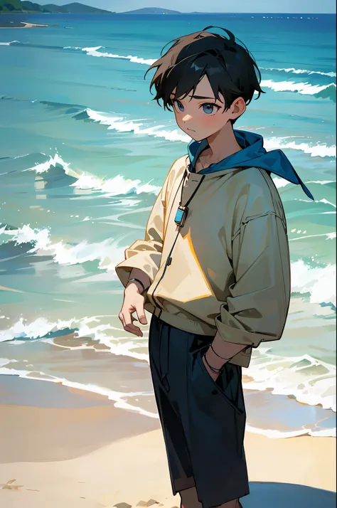 boy with blue ring on finger on a beach
