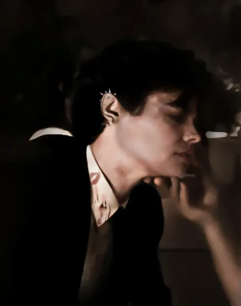 There is a man smoking a cigarette in a dark room., delicate androgynous prince, foto de perfil, inspirado en Jean Malouel, beautiful androgynous prince, inspired by Kristian Kreković, Retrato by Timothée Chalamet, alicia cullen, patillas, por Anna Fussli,...