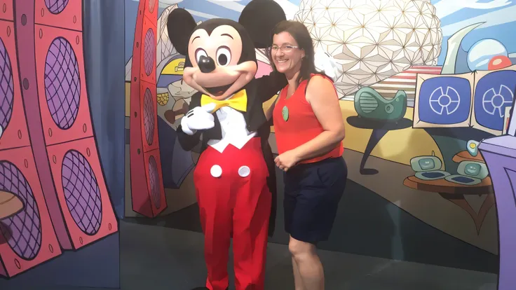 mickey mouse and minnie mouse pose for a photo in front of a mural, usa-sep 20, mickey mouse, disney artist, epcot, photo taken in 2018, in disney, minnie mouse, goofy, sandra, & even a little mouse, by Kathleen Scott, at california adventure, sarah, mom, ...