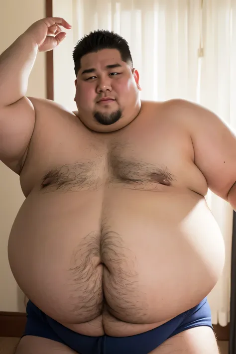 A very fat shirtless male sumo wrestler with a very fat belly