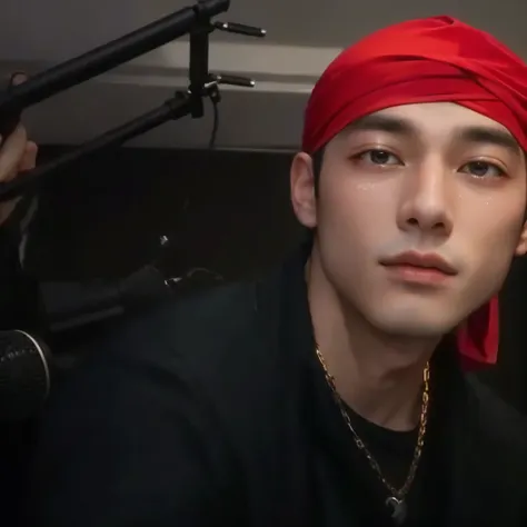 there is a man with a red scarf on his head sitting in front of a microphone, he is wearing a red scarf, Taehyung eating Gucci fries, glossy from rain, wearing a red rear-facing cap, wearing a bandana and chain, hyung tae, taken at the beginning of 2020, g...