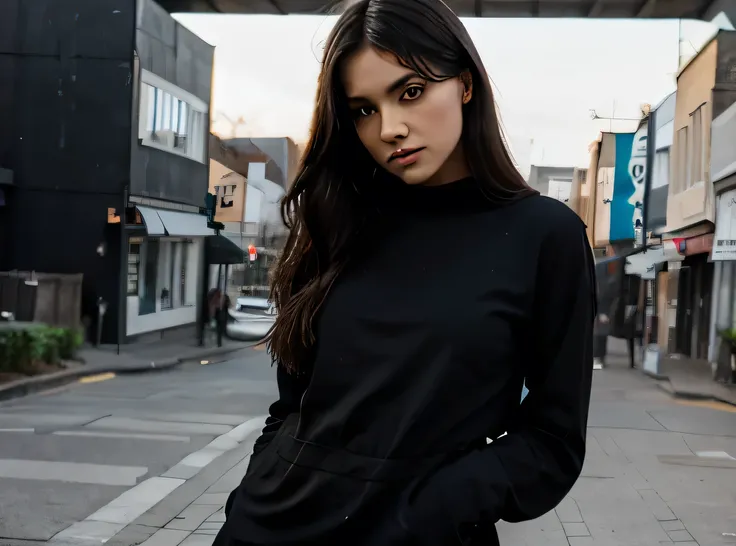 woman wearing black clothing posing with a scene behind