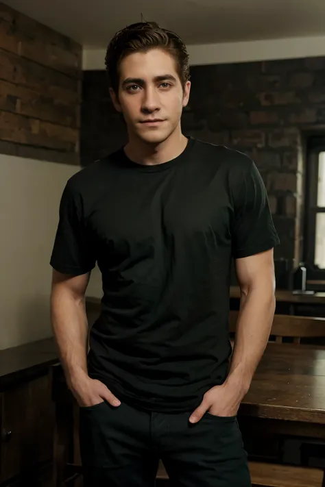 A young Jake Gyllenhaal, 20 years old, no beard or mustache, wearing a full-length black T-shirt and dark green jeans