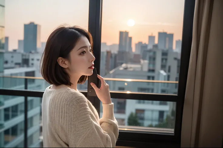 A beautiful mature woman looking at the sunset in Tech Town from the window of a high-rise apartment、