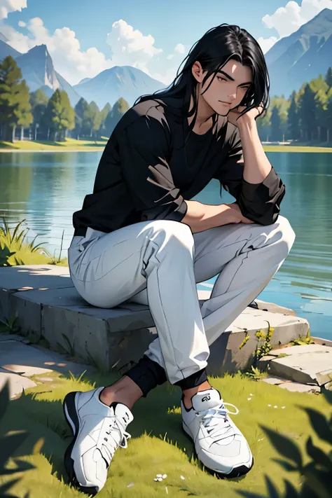 Man with long black hair, He wears a black shirt and white pants with white tennis shoes., sitting on the grass near a lake