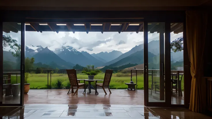 Heavy rain in front of the terrace of the house with the mountains in the background 