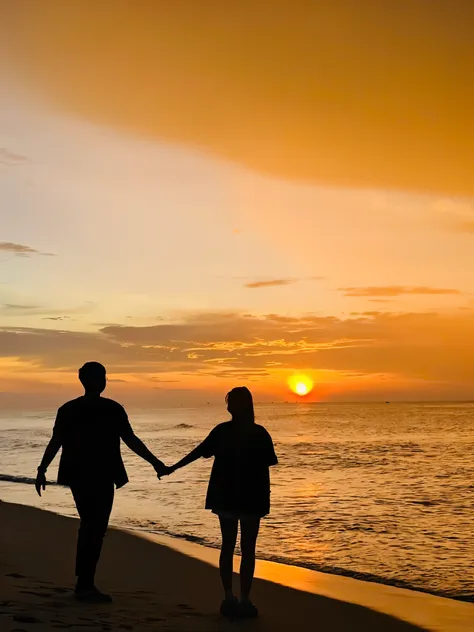 the couple walking by the sea