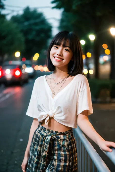 Nighttime street scene with a young woman smiling. She has short, straight black hair with bangs, wearing a white crop top and a necklace. The street is dimly lit by soft lights, with trees and buildings in the background. The mood is casual, relaxed, and ...