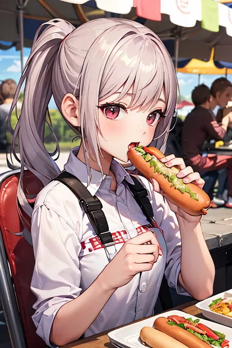 woman eating hot dog