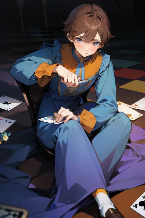 Cute boy, brown hair, long sleeved loose dress in blue, yellow, purple, orange and roses, holding playing cards, sitting