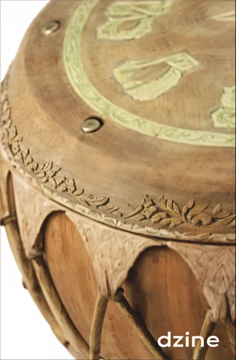 a close up of a drum with a wooden top and a green design, features intricate detail, stunning detail, breathtaking detail, detailed picture, with ornamental edges, intricately carved, elaborate detail, meticulous detail, intricate detailing, intricate sup...