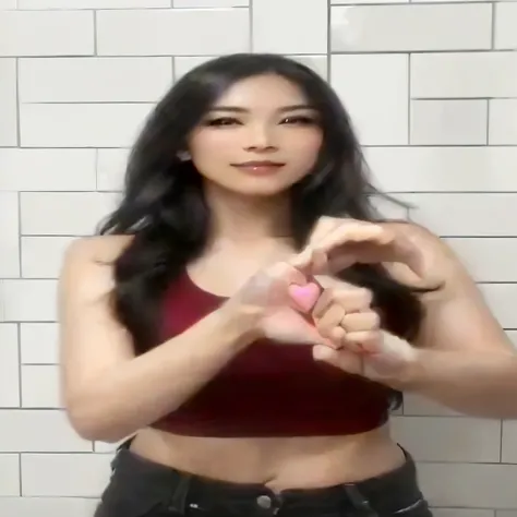 there is a woman standing in a bathroom making a heart sign, hand gesture, tiktok video, hand gestures, wave a hand at the camera, serpentine pose gesture, hands behind her body pose!, low quality video, hands behind her pose!, she is dancing. realistic, g...