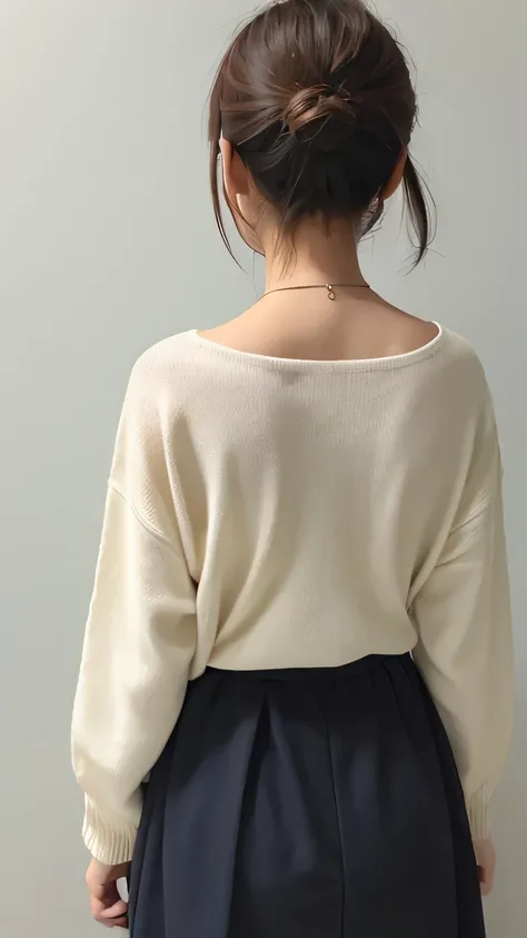 Woman wearing a back knit。I cant see my face from here。The back of the head is visible。 turning back 。