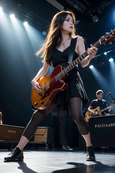 There is a band on stage. Two female vocalists are singing and holding hands. On the left is a guitarist with a black guitar, on the right is a bassist with a red bass guitar. In the background is a drummer and a string section. On the sides is a keyboard ...