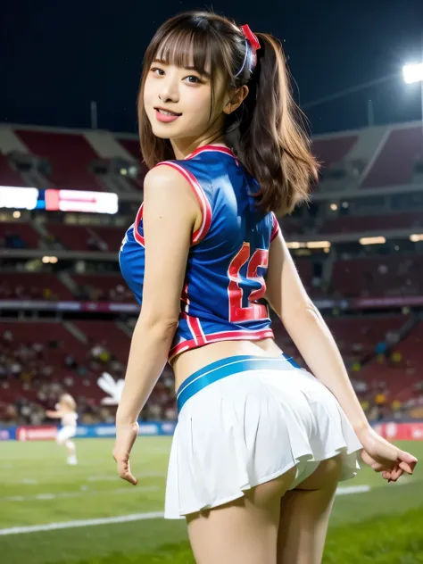 A young woman in a vibrant cheerleader costume stands out under the dazzling floodlights of a soccer stadium. Her outfit, featuring a playful design with a flared miniskirt and a bold, bright bow, sways slightly with her energetic movements. She grips blue...