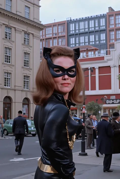 Diana rigg wearing emma peel catsuit, wearing black eye mask, wearing black leather knee high boots, full body shot, 1966 picadilly circus.