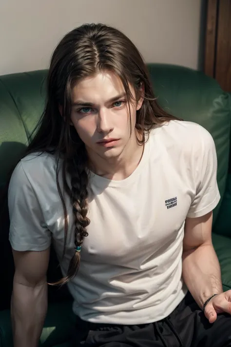 Nordic male man with long hair with dreadlocks and green eyes,  full lips, square face,  athletic body, white shirt sitting on a black couch.