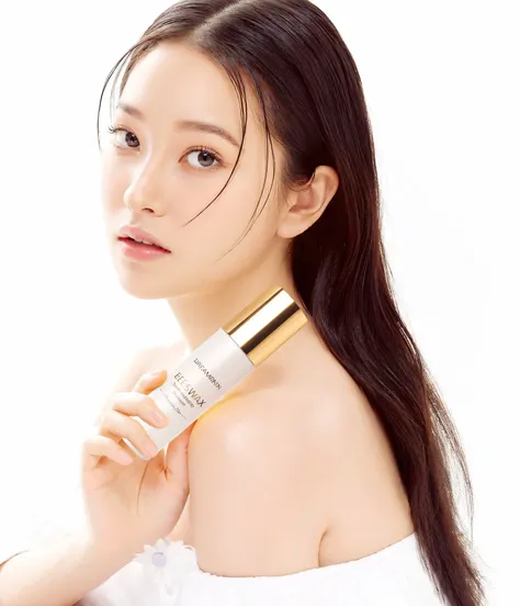 A portrait of a young woman with long dark hair. She is wearing a white off-the-shoulder top with a floral pattern. The woman is holding a bottle of skincare product in her right hand and is looking directly at the camera with a serious expression. The bot...