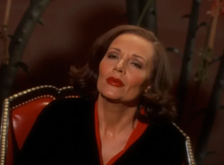 tallulah bankhead as 1966 batman villainess black widow.  wearing her black outfit, wearing black leather gloves, wearing black knee high leather boots, standing looking ahead