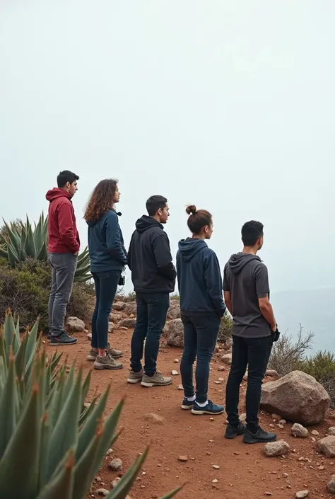 A small group of Christian people standing on a rocky summit, profile, looking at the horizon, but the horizon is not visible in the image — the area above the summit appears as a And empty. People wear modern casual clothes, like jackets ,  t-shirts and p...