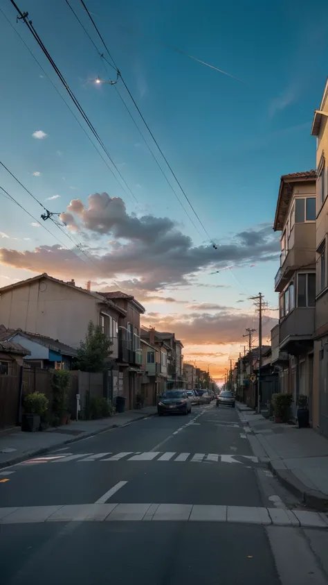 Photo with the perspective of an elongated street, displays a composition of lines of electricity poles and wires directing the view to the horizon. The colorful twilight sky contrasts with the dark shadows of buildings and streets