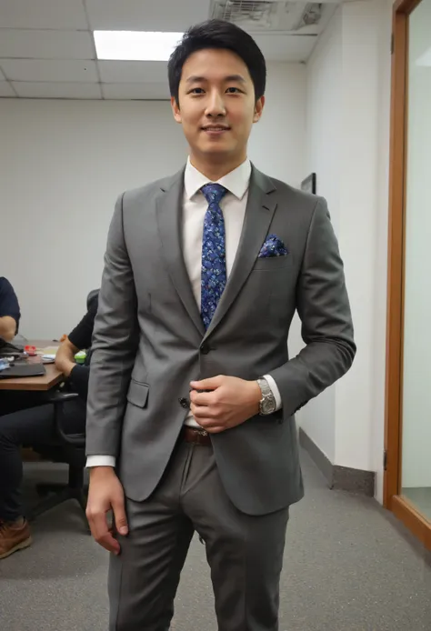 Asian young man in grey suit.(Outer suit removed) Looks very handsome in the office, highlights the bulge under the crotch, tilts up to the left, has a long cylindrical shape showing very big bulge in pant, photorealistic skin texture, full body
