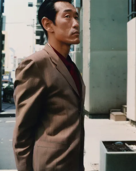 color film photograph, man, 1980s tokyo, suit, brown eyes <lora:80s japan 2:0.5>