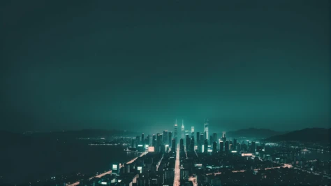 a city skyline at night with a green light